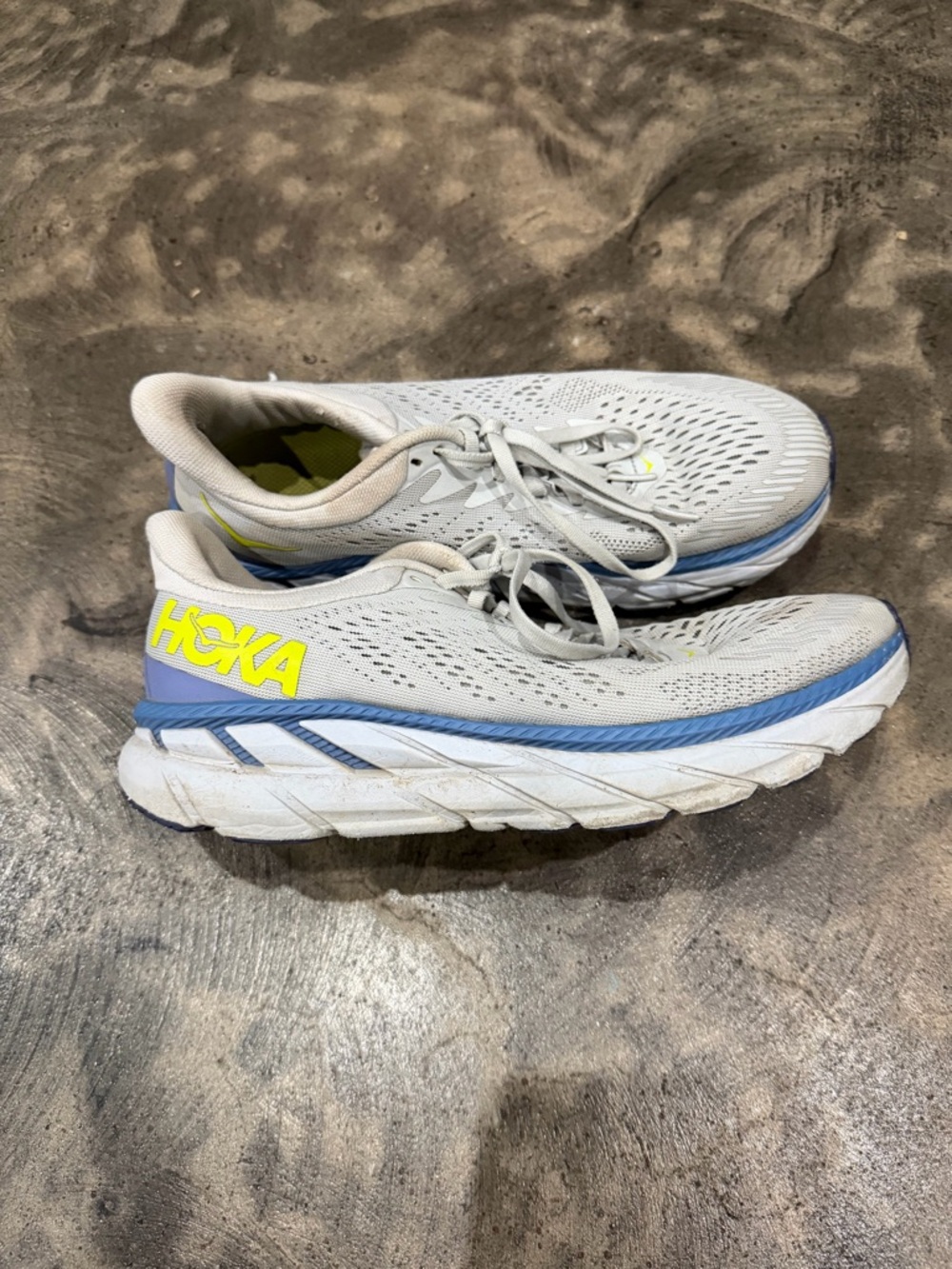 Hoka Neutral White Trainers with Blue Trim and Yellow Logo